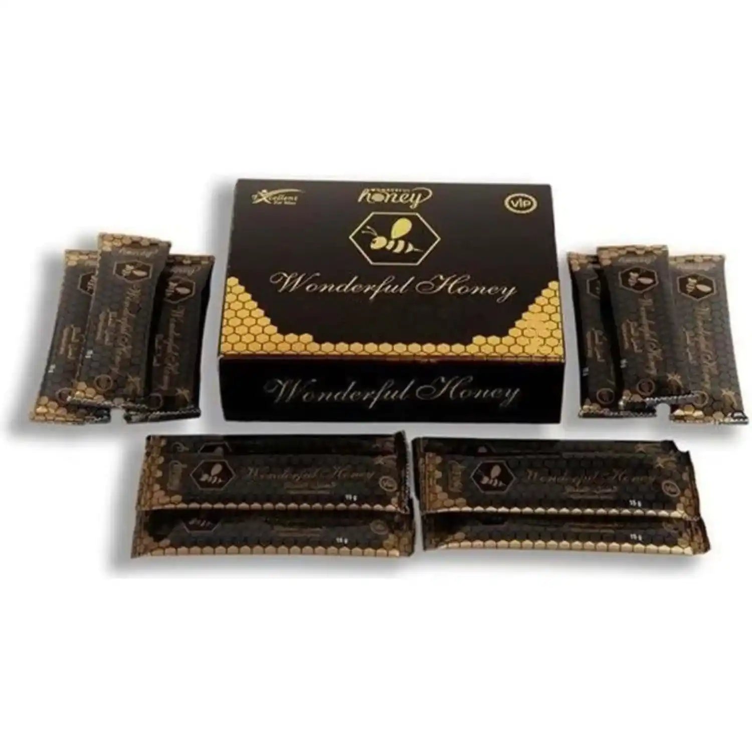 Miel merveilleuse dans une boîte noire avec un motif de mielier et des sachets individuels.